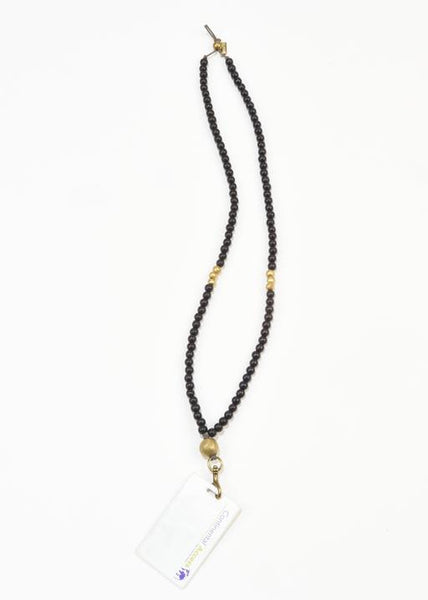WOOD AND BRASS BADGE NECKLACE